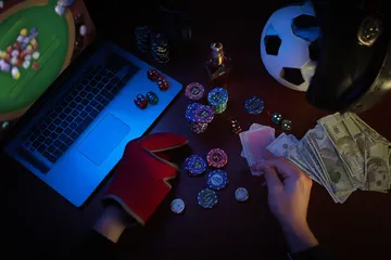 A cheerful woman in traditional clothing using her smartphone during a festive moment, showing how easily the 5666BET app fits into everyday life.