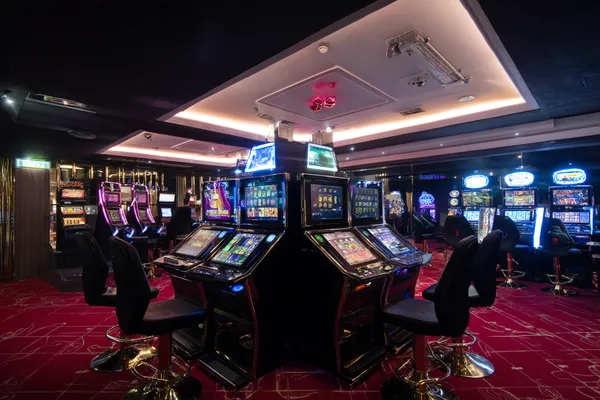 A person using their device against a moody casino-themed background, illustrating the smooth re-entry process at 5666BET.